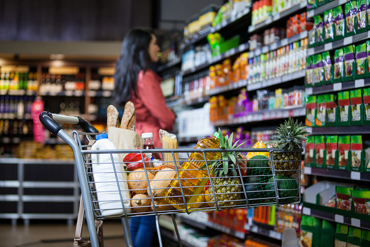 Grocery Cart with Shopper Behind