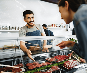 Man at meat counter