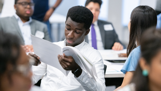 Young student studying a workbook