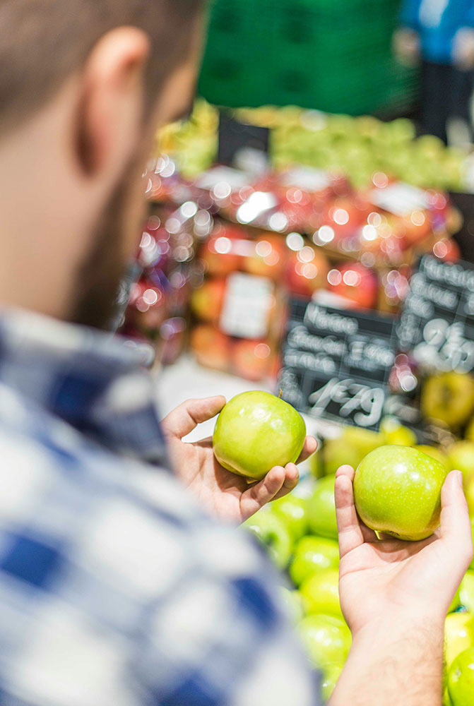 person displaying fruit